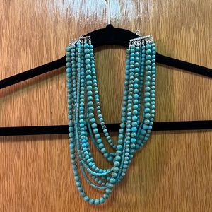 Multi-strand turquoise necklace.